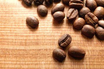 Close up roasted coffee beans on wood background
