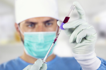 blood analysis - doctor with syringe in front of face