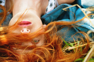 Girl lying in a meadow
