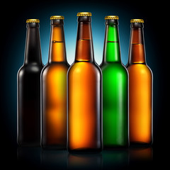 Set of beer bottles with clipping path isolated on black gradient background