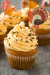 Thanksgiving cupcakes on wooden background

