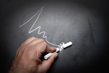 wavy-line-and-broken-chalk-stick-on-blackboard-focus-on-chalk-fa
