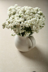 Baby breath flowers in white jug