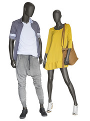 Two mannequins, male and female, dressed in casual clothes.