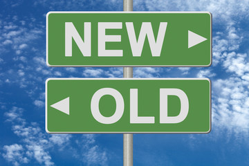 Signpost on green nameplate on sky background