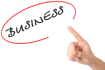 Hand of a young girl points to a word