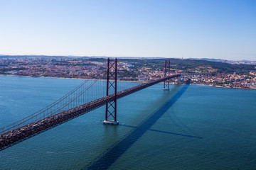25th of April Suspension Bridge over the Tagus riCristo-Rever in Lisbon, Portugal, view from Cristo-Rei statue