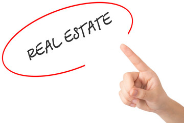 Hand of a young girl points to a word