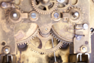 Old clockwork dirty with dust and lubricating oil. Selective foc