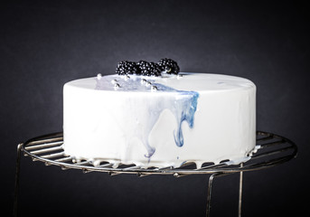 Homemade bright mousse cake with mirror glaze. Toned