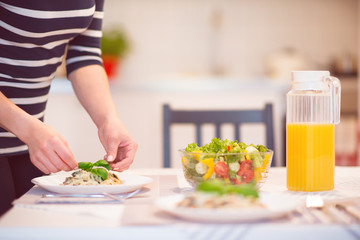 Fresh spaghetti with creamy mushroom sauce and basil leaf