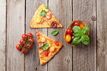 Pizza with tomatoes, mozzarella and basil