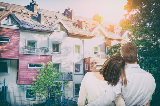 Young couple looking at dream house.