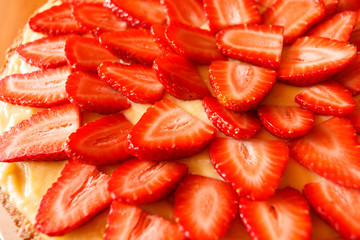 Delicious strawberry tart on table