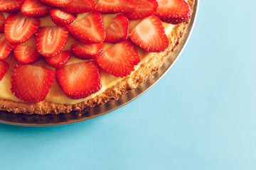 Delicious strawberry tart on table