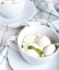 Vanilla ice cream on white wood bacgkround