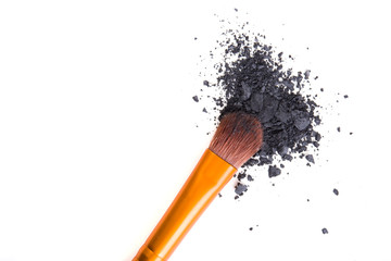 Professional makeup brush and loose powder eyeshadows isolated