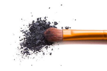 Professional makeup brush and loose powder eyeshadows isolated