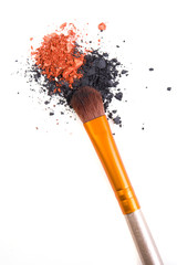 Professional makeup brush and loose powder eyeshadows isolated