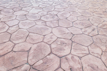 Closeup surface brick pattern at old red stone brick floor at pathway texture background