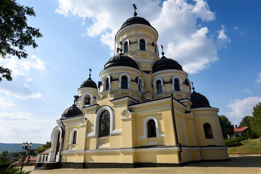 Photo of Capriana Monastery in Moldova with blue sky