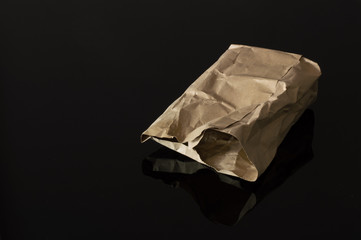 Brown Paper Bag Isolated on Black Background