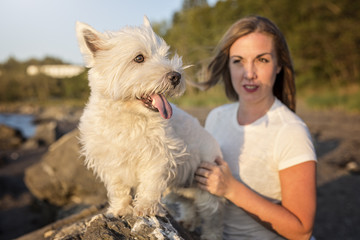 portrait of beautiful girl pretty white West Highland dog