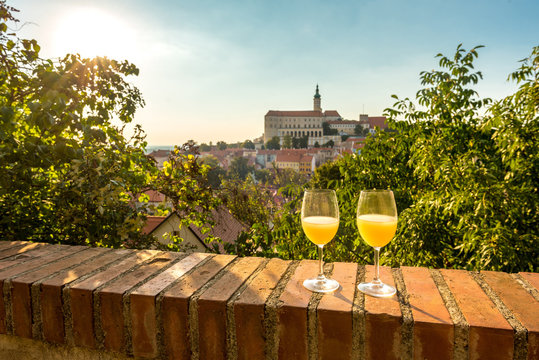 Two glasses of young wine (burcak) traditional drink at the end of summer and autumn when grapes are riped, Mikulov, South Moravia region, Czech Republic
