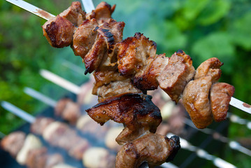 Roasted meat on the grill outdoors