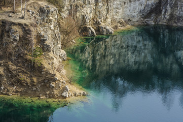 Beautiful view on azure lake and cliffed coast