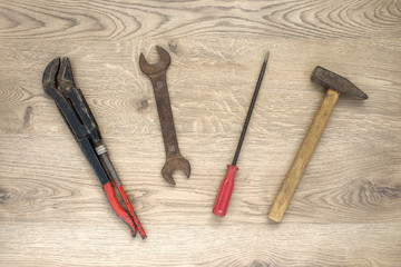 Old tools on wooden background