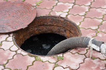 pumping sewage from the hole