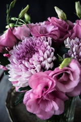 Bouquet of pink flowers in vase vintage decor