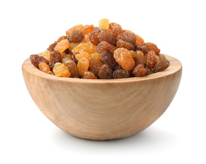Wooden bowl of assorted raisins isolated on white