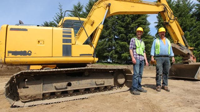 Construction workers meeting and talking on job site
