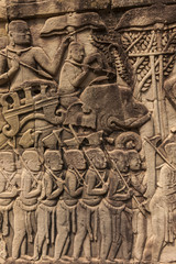 Bas-reliefs with war scenes in Bayon temple, Angkor, Cambodia