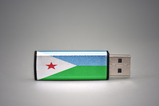 usb flash drive with the national flag of djibouti on gray background.