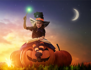 Fototapeta premium little witch outdoors