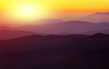 Silhouettes of the mountain hills at sunset