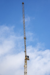 Obraz premium Tower crane on the background of sky.