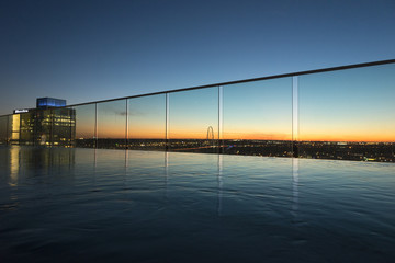 Fototapeta na wymiar View of infinity pool at dusk, Victory Park, Dallas, Texas, USA