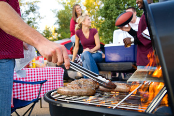 Tailgating: Bratwurst or Sausage On The Grill At Tailgate Party - obrazy, fototapety, plakaty