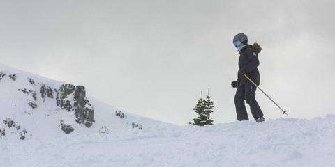 Naklejka na ściany i meble Skier on snow covered mountain, Whistler, British Columbia, Cana