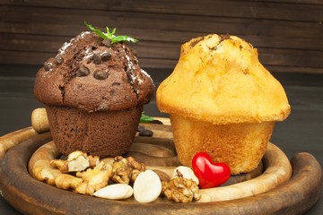 Homework muffins for breakfast. Sweet junk food. Chocolate dessert. Fresh muffins on the kitchen table. Advertising for desserts.
