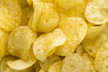 Close up potato chips on top view background.