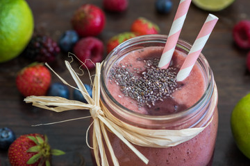 Fresh Berry Fruit Smoothie with Chia Seeds on Rustic Wooden Background