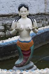 Close up of a female likeness statue.