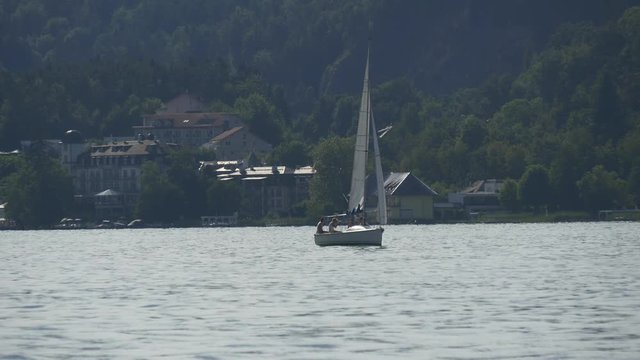 Boat sailing in mountain lake