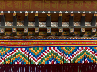 An exterior close up of a Buddhist temple.