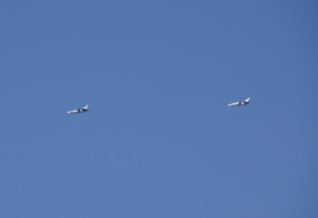 Flying fighter in the sky. Military aircraft exercises.